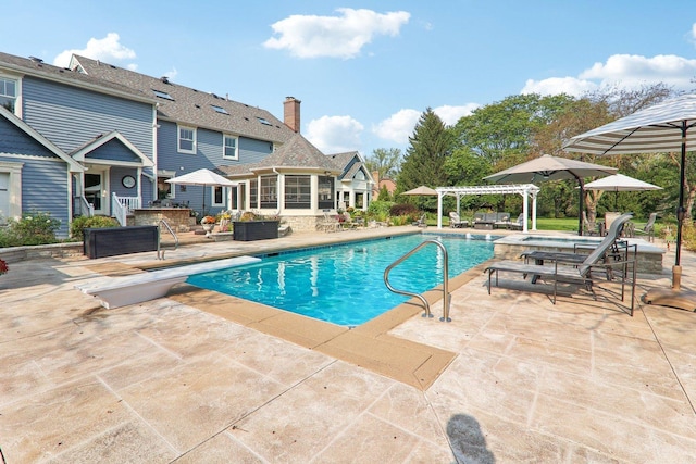 outdoor pool featuring a pergola, a sunroom, a patio area, and a diving board
