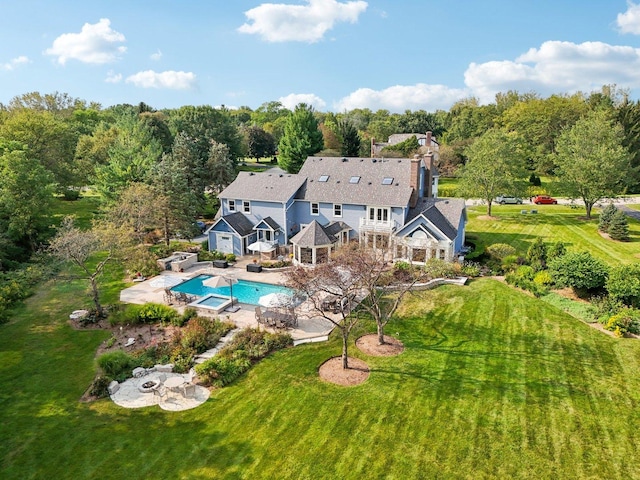 exterior space with a patio, a yard, and an outdoor pool