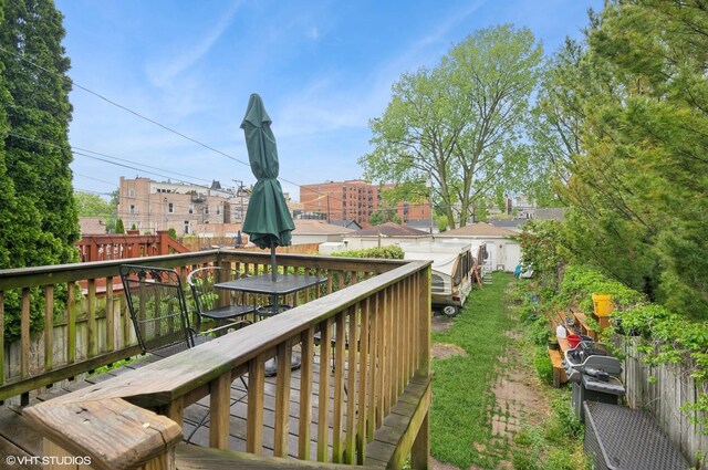 4134 S Ellis Ave, Chicago, IL 60653 - view of yard featuring a wooden deck and outdoor dining area