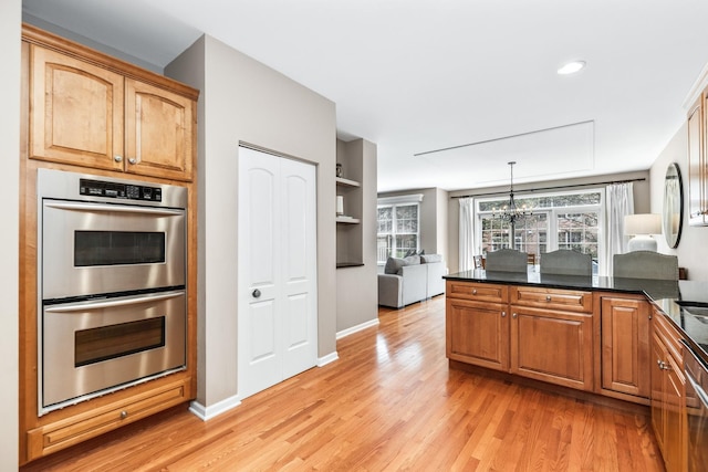 405 Ashbury Ln, Lemont, IL 60439 - kitchen featuring stainless steel double oven, light wood finished floors, open floor plan, and baseboards