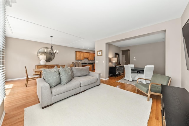 405 Ashbury Ln, Lemont, IL 60439 - living area featuring baseboards, light wood finished floors, a chandelier, and recessed lighting