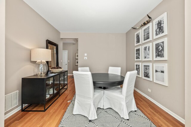 405 Ashbury Ln, Lemont, IL 60439 - dining space with light wood-style flooring and baseboards