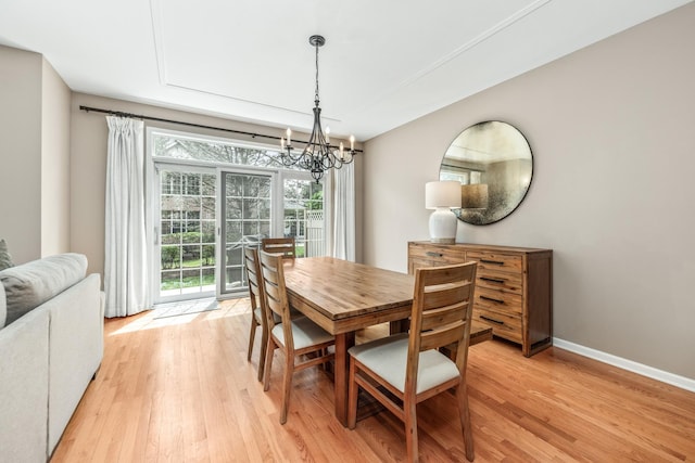 405 Ashbury Ln, Lemont, IL 60439 - dining area featuring a chandelier, light wood-type flooring, and baseboards