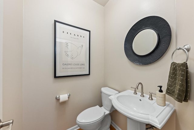 405 Ashbury Ln, Lemont, IL 60439 - half bath featuring toilet, baseboards, and a sink