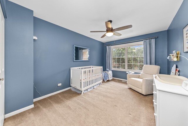 405 Ashbury Ln, Lemont, IL 60439 - bedroom with carpet floors, baseboards, a crib, and a ceiling fan