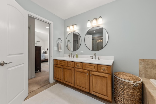 405 Ashbury Ln, Lemont, IL 60439 - bathroom with double vanity, a tub, a shower, vaulted ceiling, and ensuite bath