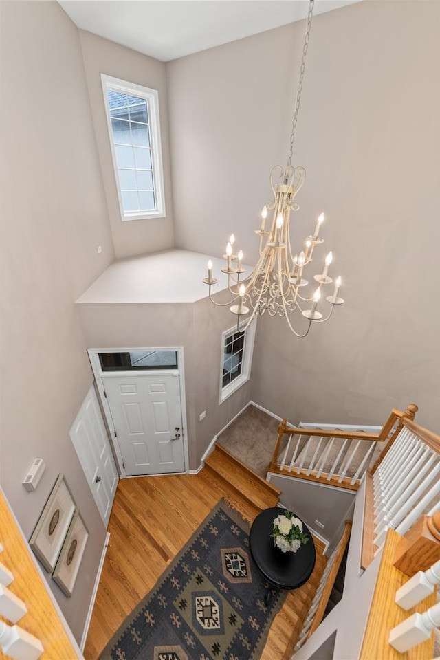 405 Ashbury Ln, Lemont, IL 60439 - foyer entrance featuring a chandelier and wood finished floors