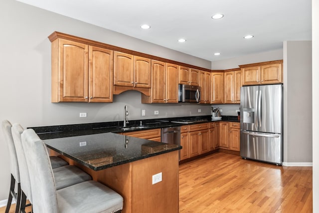 405 Ashbury Ln, Lemont, IL 60439 - kitchen featuring stainless steel appliances, a sink, a peninsula, dark stone countertops, and recessed lighting