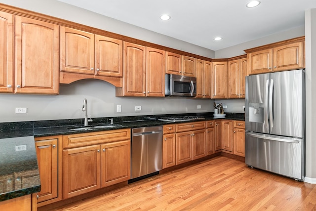 405 Ashbury Ln, Lemont, IL 60439 - kitchen featuring appliances with stainless steel finishes, a sink, dark stone counters, light wood finished floors, and recessed lighting