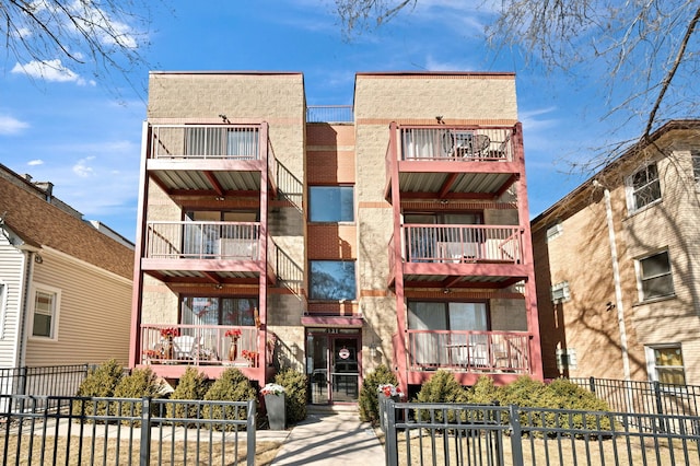 4716 W Addison St Unit 2W, Chicago, IL 60641 - view of building exterior featuring a fenced front yard
