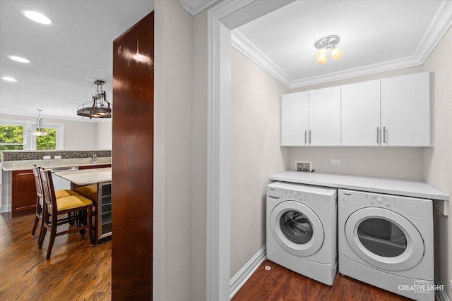 45 Exmoor Ave, Glen Ellyn, IL 60137 - washroom featuring cabinet space, washing machine and clothes dryer, crown molding, dark wood-style flooring, and recessed lighting