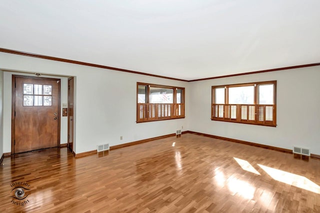 unfurnished living room featuring baseboards, light wood-style flooring, and visible vents