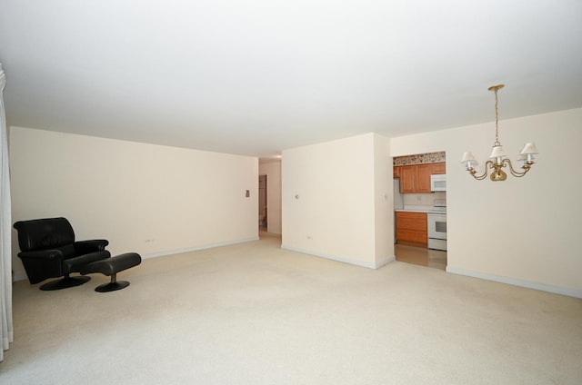 4248 Saratoga Ave Unit 308, Downers Grove, IL 60515 - unfurnished room featuring a chandelier, light colored carpet, and baseboards