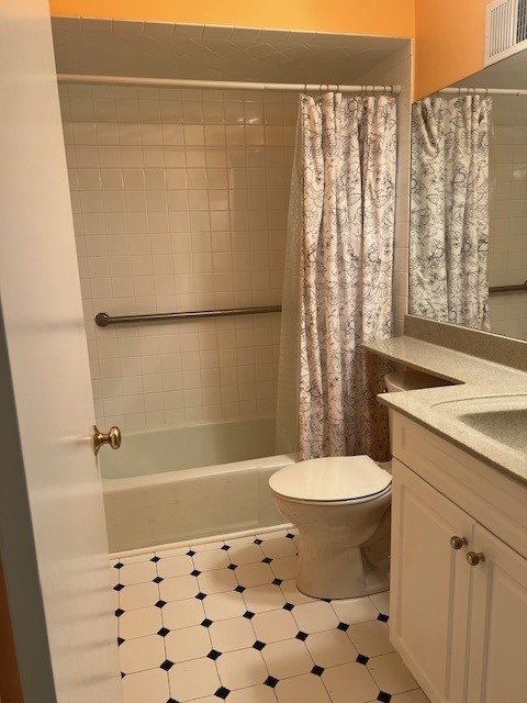 4901 Golf Rd Unit 405, Skokie, IL 60077 - full bath with visible vents, toilet, vanity, and shower / bath combination with curtain
