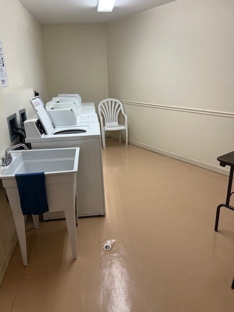 4901 Golf Rd Unit 405, Skokie, IL 60077 - shared laundry area featuring separate washer and dryer and a sink