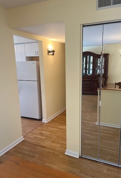 4901 Golf Rd Unit 405, Skokie, IL 60077 - corridor with visible vents, baseboards, and wood finished floors