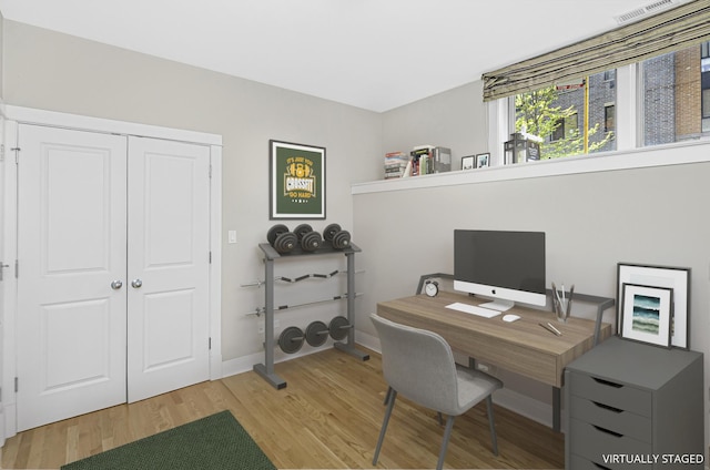 1459 W Melrose St Unit 1N, Chicago, IL 60657 - home office with light wood-style flooring and baseboards