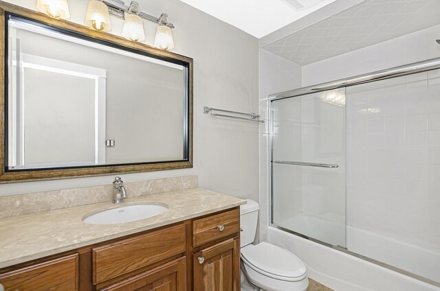 1459 W Melrose St Unit 1N, Chicago, IL 60657 - bathroom with toilet, vanity, and bath / shower combo with glass door