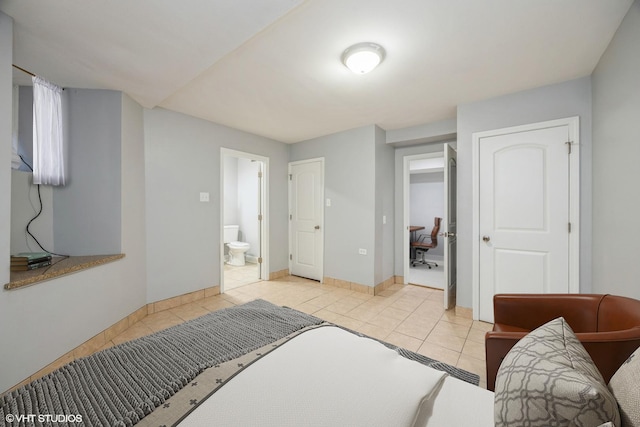 4337 S Prairie Ave Unit G, Chicago, IL 60653 - bedroom with tile patterned flooring, ensuite bathroom, and baseboards