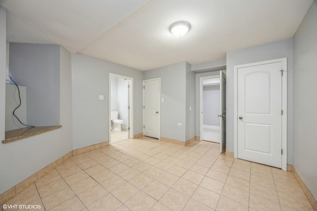 4337 S Prairie Ave Unit G, Chicago, IL 60653 - spare room featuring light tile patterned flooring and baseboards