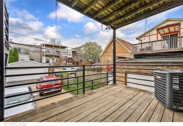wooden deck with central AC unit