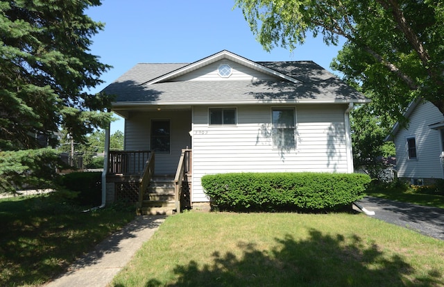 3902 Rose Ave, Western Springs, IL 60558 - view of front of house featuring a front lawn, a porch, and a shingled roof