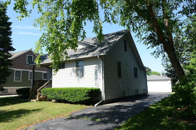 3902 Rose Ave, Western Springs, IL 60558 - view of side of property with an outdoor structure, a yard, and a garage