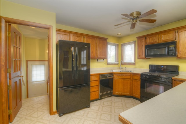 3902 Rose Ave, Western Springs, IL 60558 - kitchen featuring black appliances, light countertops, brown cabinets, and a ceiling fan