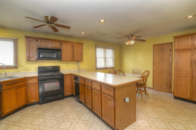 3902 Rose Ave, Western Springs, IL 60558 - kitchen with black appliances, ceiling fan, a peninsula, brown cabinetry, and light countertops