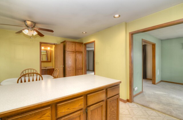 3902 Rose Ave, Western Springs, IL 60558 - kitchen featuring ceiling fan, brown cabinetry, recessed lighting, light colored carpet, and light countertops