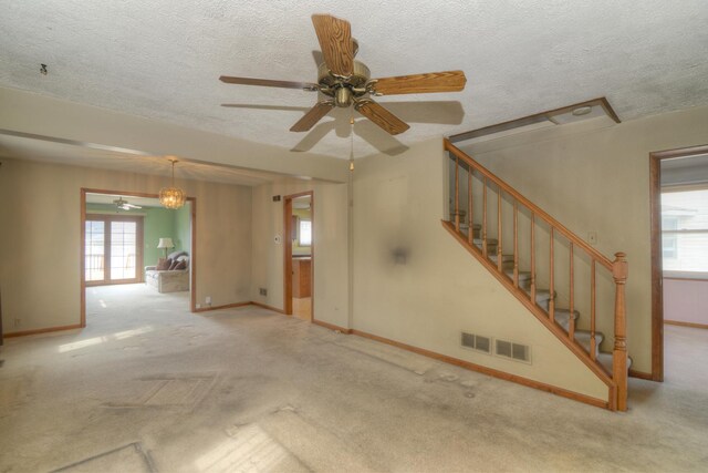 3902 Rose Ave, Western Springs, IL 60558 - unfurnished living room featuring ceiling fan, carpet floors, stairway, and a textured ceiling