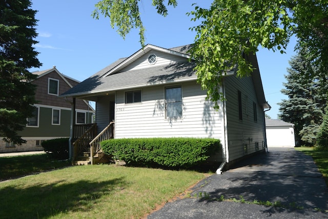 3902 Rose Ave, Western Springs, IL 60558 - view of front of property featuring a front yard, an outbuilding, and a detached garage