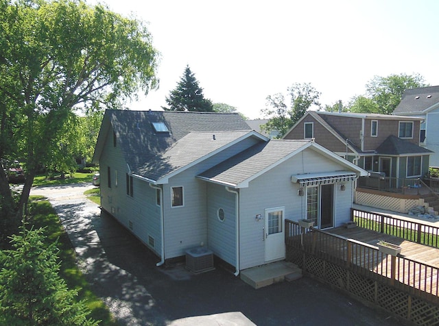 3902 Rose Ave, Western Springs, IL 60558 - back of property with a deck, a shingled roof, and asphalt driveway