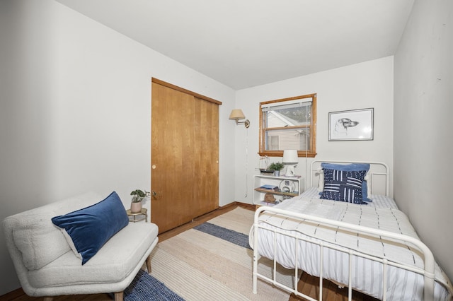 bedroom featuring a closet and wood finished floors