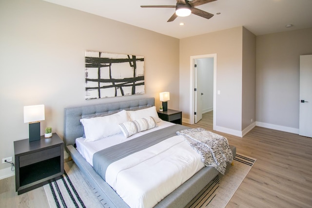bedroom featuring recessed lighting, light wood-type flooring, baseboards, and ceiling fan