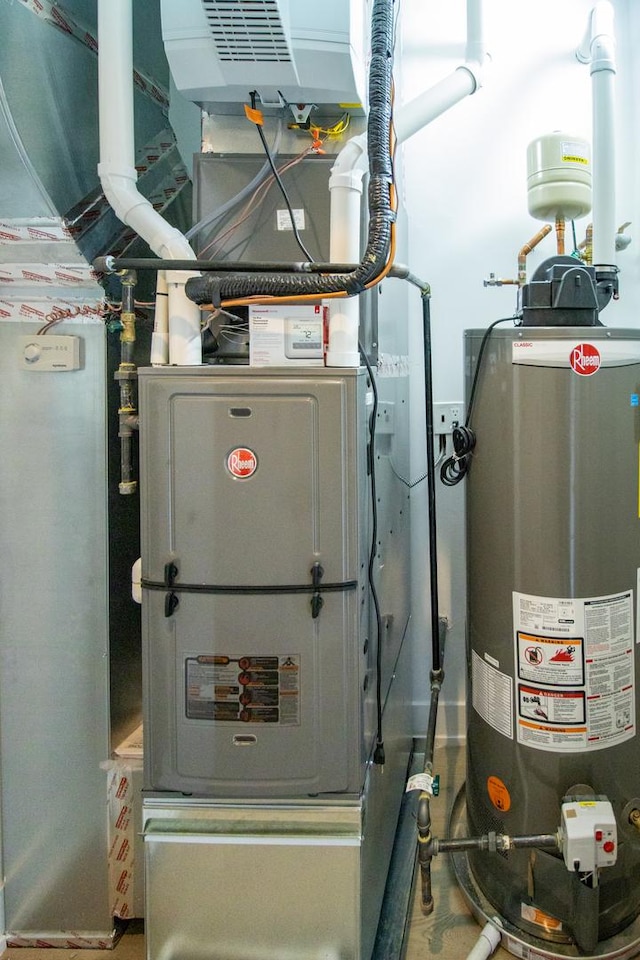 utility room featuring gas water heater