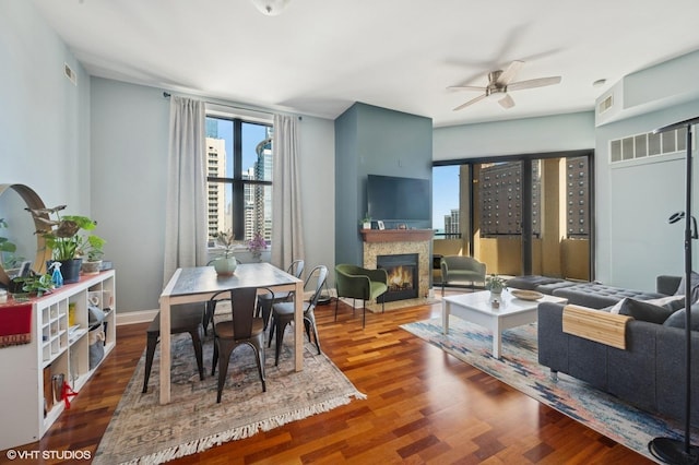 1464 S Michigan Ave Unit 1401, Chicago, IL 60605 - dining space with ceiling fan, a warm lit fireplace, and wood finished floors