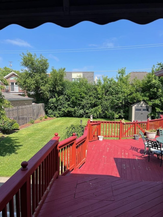 1911 N 73rd Ave N, Elmwood Park, IL 60707 - wooden deck featuring a lawn and a storage unit