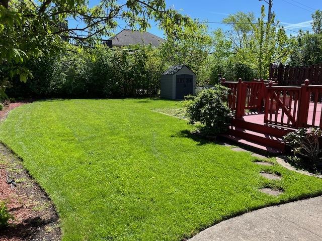 1911 N 73rd Ave N, Elmwood Park, IL 60707 - view of yard featuring a storage shed and a wooden deck