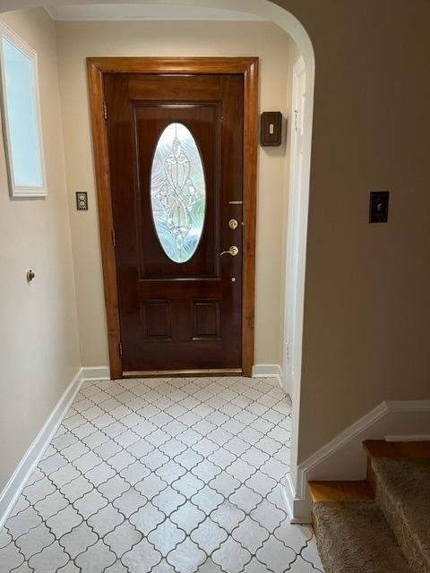 1911 N 73rd Ave N, Elmwood Park, IL 60707 - foyer with stairway, arched walkways, and light floors