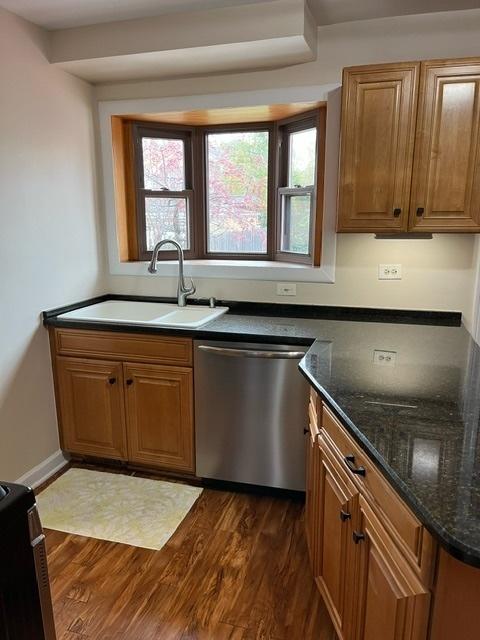 1911 N 73rd Ave N, Elmwood Park, IL 60707 - kitchen with dishwasher, dark wood-type flooring, brown cabinets, and healthy amount of natural light
