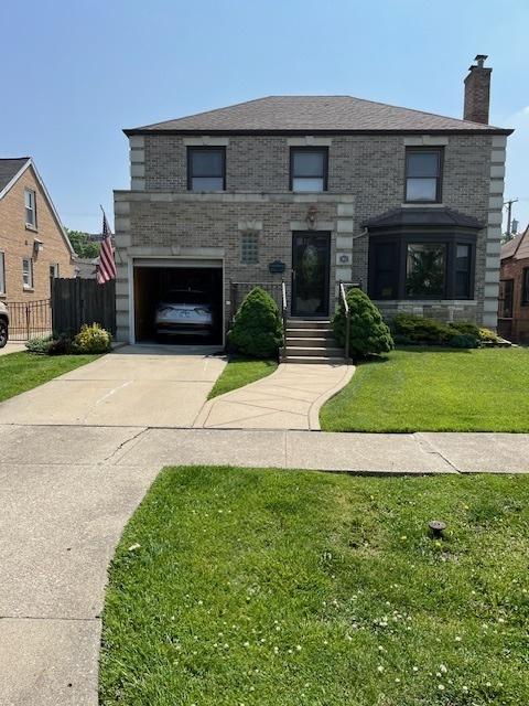 1911 N 73rd Ave N, Elmwood Park, IL 60707 - view of front of home with concrete driveway, a chimney, a garage, and stone siding
