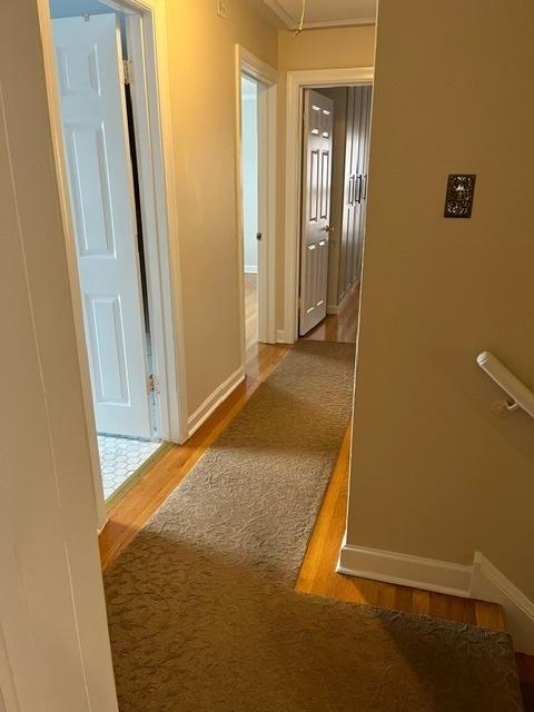 1911 N 73rd Ave N, Elmwood Park, IL 60707 - hallway featuring wood finished floors and attic access