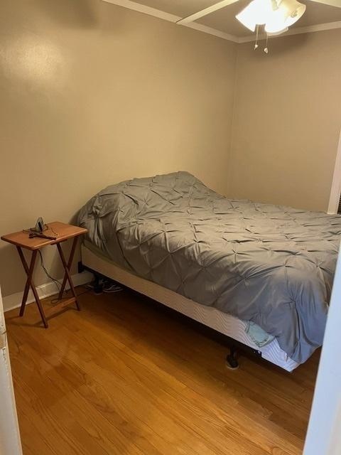 1911 N 73rd Ave N, Elmwood Park, IL 60707 - bedroom featuring ornamental molding, wood finished floors, and a ceiling fan