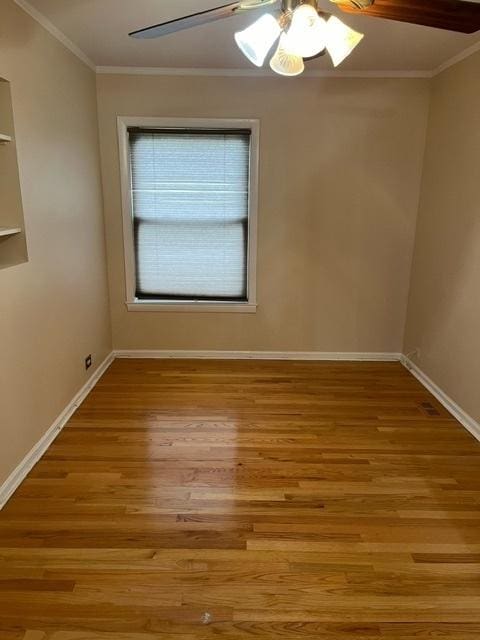 1911 N 73rd Ave N, Elmwood Park, IL 60707 - unfurnished room featuring ornamental molding, light wood-type flooring, and a ceiling fan