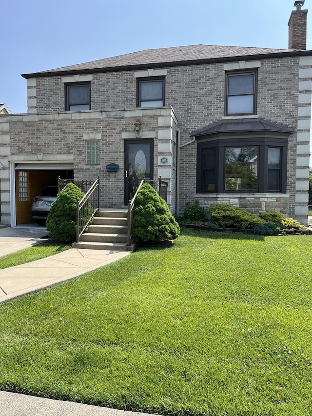 1911 N 73rd Ave N, Elmwood Park, IL 60707 - view of front of property with a front lawn, brick siding, a chimney, and an attached garage