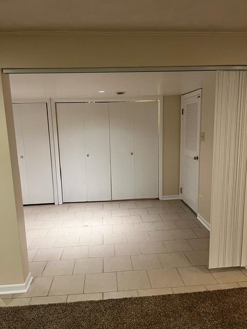 1911 N 73rd Ave N, Elmwood Park, IL 60707 - unfurnished bedroom with baseboards and crown molding