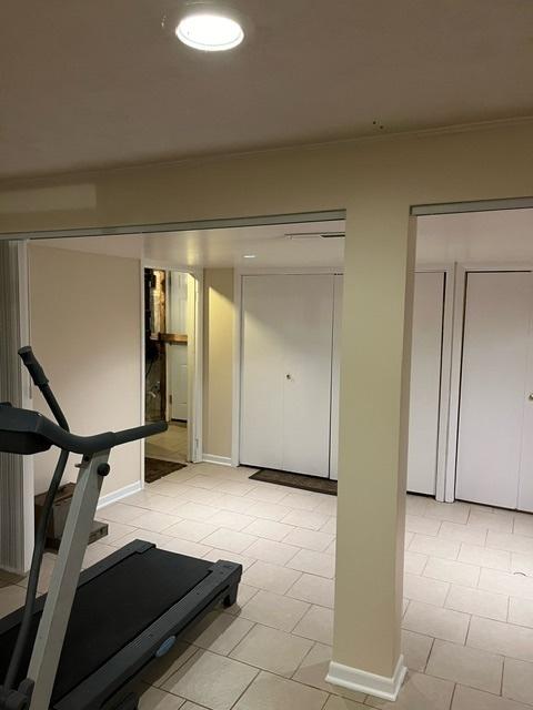 1911 N 73rd Ave N, Elmwood Park, IL 60707 - exercise area featuring light tile patterned flooring and baseboards
