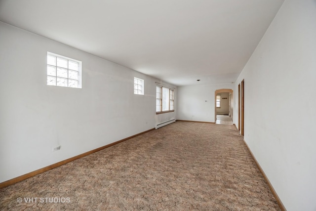 3101 S 53rd Ct, Cicero, IL 60804 - carpeted spare room featuring arched walkways, a baseboard radiator, and baseboards