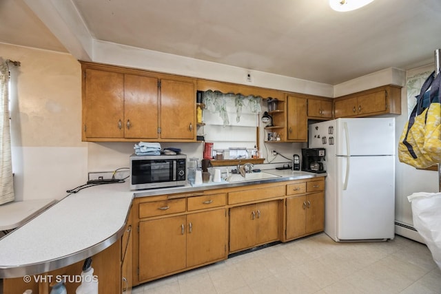3101 S 53rd Ct, Cicero, IL 60804 - kitchen with a sink, freestanding refrigerator, stainless steel microwave, and brown cabinets